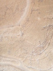 Abstract background of sand under ice.