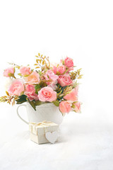 Fototapeta premium heart gift and pink flowers. Holiday, Weekend, Wedding, Valentine's day, Happy Mothers Day, birthday greeting card. heart and flowers on white background. Holiday spring season, festive design