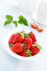 Fresh strawberry in bowl on table