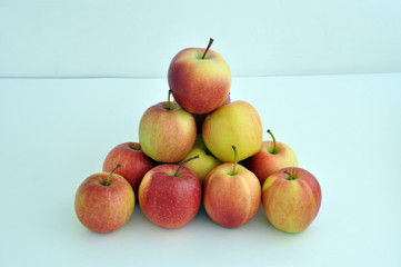 Group of red apples with their leaves