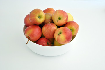 Group of red apples with their leaves