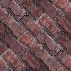 Seamless pattern of red wall from natural stone bricks.