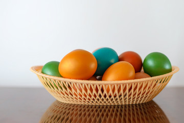 Painted multi-colored paint Easter eggs with a basket