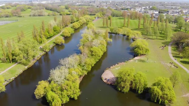 Aerial view of the lake in the middle of Gloucester Park, Basildon on a sunny day