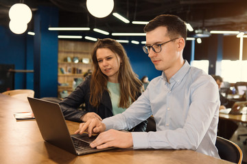 Two people working at the office. Client and manager conversatio