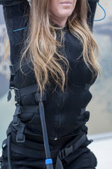 a girl doing exercises in electrofitness