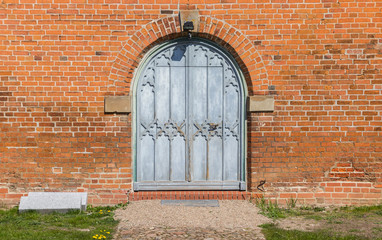 Fototapeta na wymiar Entrance to the Marien church in Boizenburg, Germany