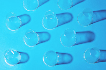 Plastic cups on blue background.