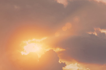 Divine shine warm light sunset from the sky cleaves the rays of cloud.