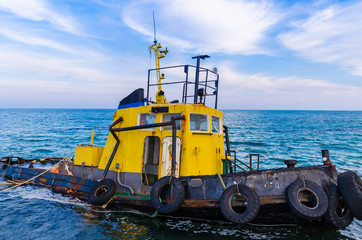Old boat in the sea in the summer season