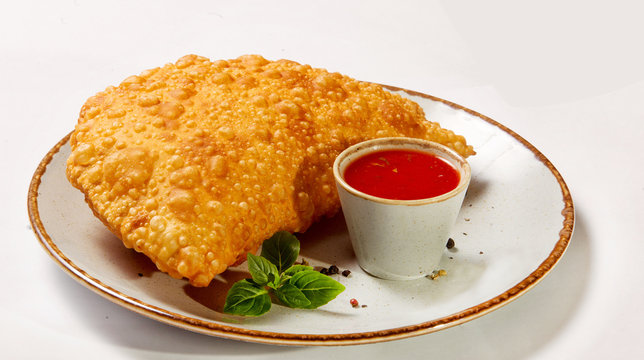 Cheburel -  dish  pancake fried in butter  with tasty twisted meat and broth inside