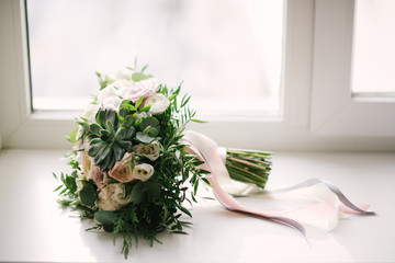 Bridal bouquet of flowers of the bride close up