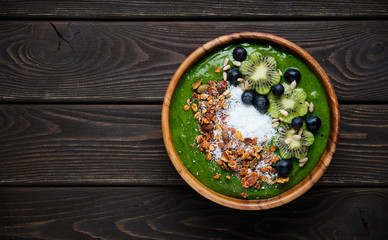 Smoothie bowls. Healthy breakfast bowl with chia seeds, muesli, berries, fruits and coconut flakes coconut flakes. Vegan food