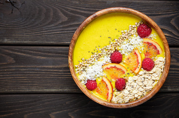 Smoothie bowls. Healthy breakfast bowl with chia seeds, muesli, berries, fruits and coconut flakes coconut flakes. Vegan food