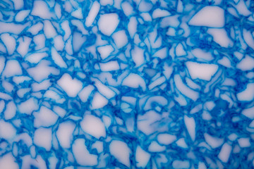 white marble with blue inclusions as background pattern