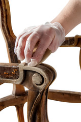 Renovation of old furniture as an antique Victorian old wooden armchair. Polishing and cleaning the...