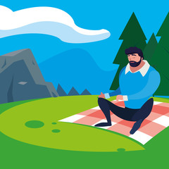 man seated in the field picnic day