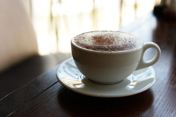 delicious hot cappuccino hot coffee in a white cup