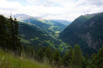Obraz premium Mountains valley small town summer cloudy sky