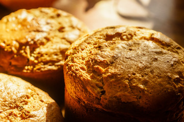 Close up of homemade fresh crusty bread on blurred background