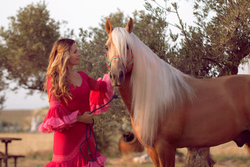 woman caressing a horse