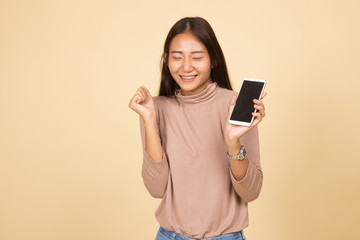 Naklejka premium Happy Young Asian woman with mobile phone.