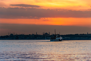 Fototapeta premium Istanbul, Turkey, 11 June 2007: Sunset of Istanbul with Silhouette of Mosques