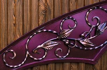 Decoration with forged elements of metal gates, flowers and leaves.