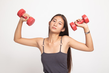 Exhausted Asian woman with dumbbells.