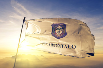 Gorontalo province of Indonesia flag waving on the top sunrise mist fog