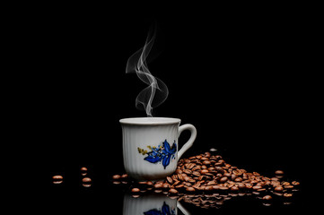 coffe  beans and cup on black background