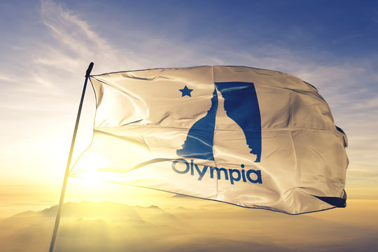 Olympia Capital Of Washington State Flag Waving On The Top Sunrise Mist Fog