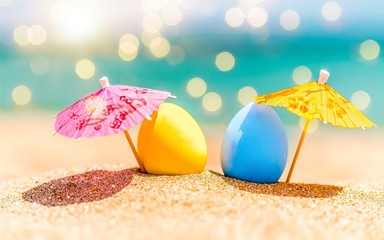 Colorful easter eggs on ocean beach