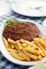 Hamburger and French Fries on a Plate