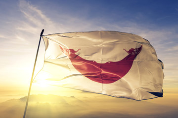 Easter Island Rapa Nui flag waving on the top sunrise mist fog