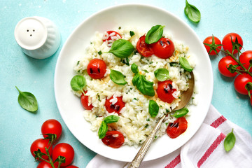 Risotto with grilled tomatoes.Top view with copy space.