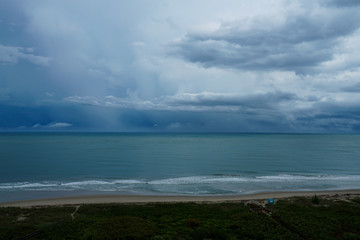 Obraz premium Stormy rainy day at the beach on North Hutchinson Island, Florida with storm clouds.