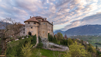 Panorama of Castle Schenna (Scena) near Meran during sunset. Schenna, Province Bolzano, South...