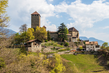 Fototapeta premium Detail view on Tyrol Castle on mountain and landscape. Tirol Village, Province Bolzano, South Tyrol, Italy.