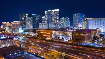 Aerial view of sin city Las Vegas Nevada strip hotels and casinos from above at night with freeway traffic. - Powered by Adobe