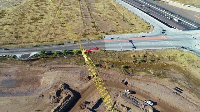Aerial Tilt Up of Crane At Construction Site