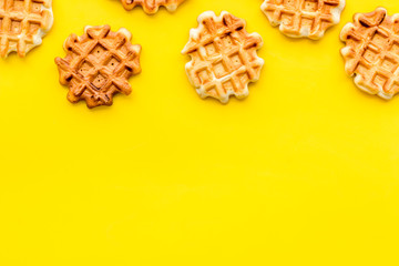 Traditional belgian waffles on yellow table background top view mockup