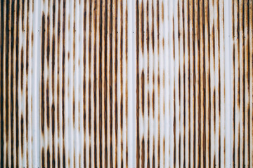 Old rusty wavy metal plate wall background