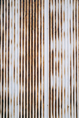 Old rusty wavy metal plate wall background