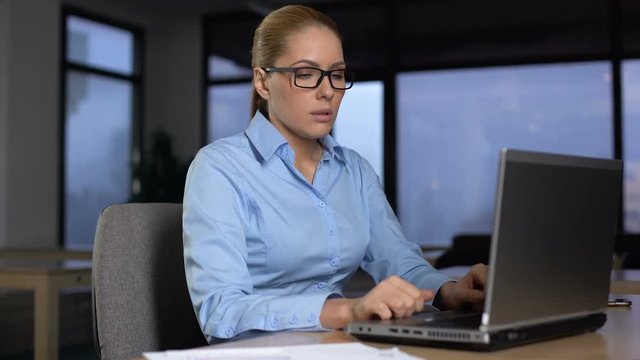 Tired woman thinking over business project, working extra hours, lack of ideas