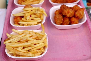 French fries and fried chicken at market