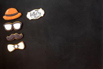 moustache, hat, glasses and copy for Happy Father Day party on black background top view copy space