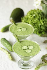 soup puree from avocado, asparagus and cucumber. Dietary detox diet. Vegetarian dish. serving soup in a glass bowl.