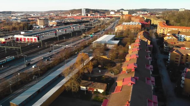 Aerial footage showing parts of Olskroken and Gamlestan, Also showing road E20, a moving tram and cars. Gothenburg, Sweden.