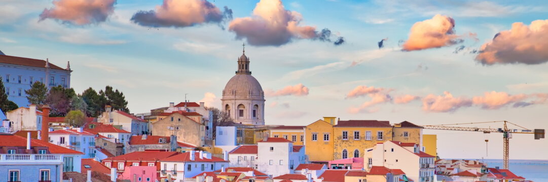 Scenic Alfama lookout with San Vicente (Saint Vincent) statue and Sao Vicente de Fora a church on the background